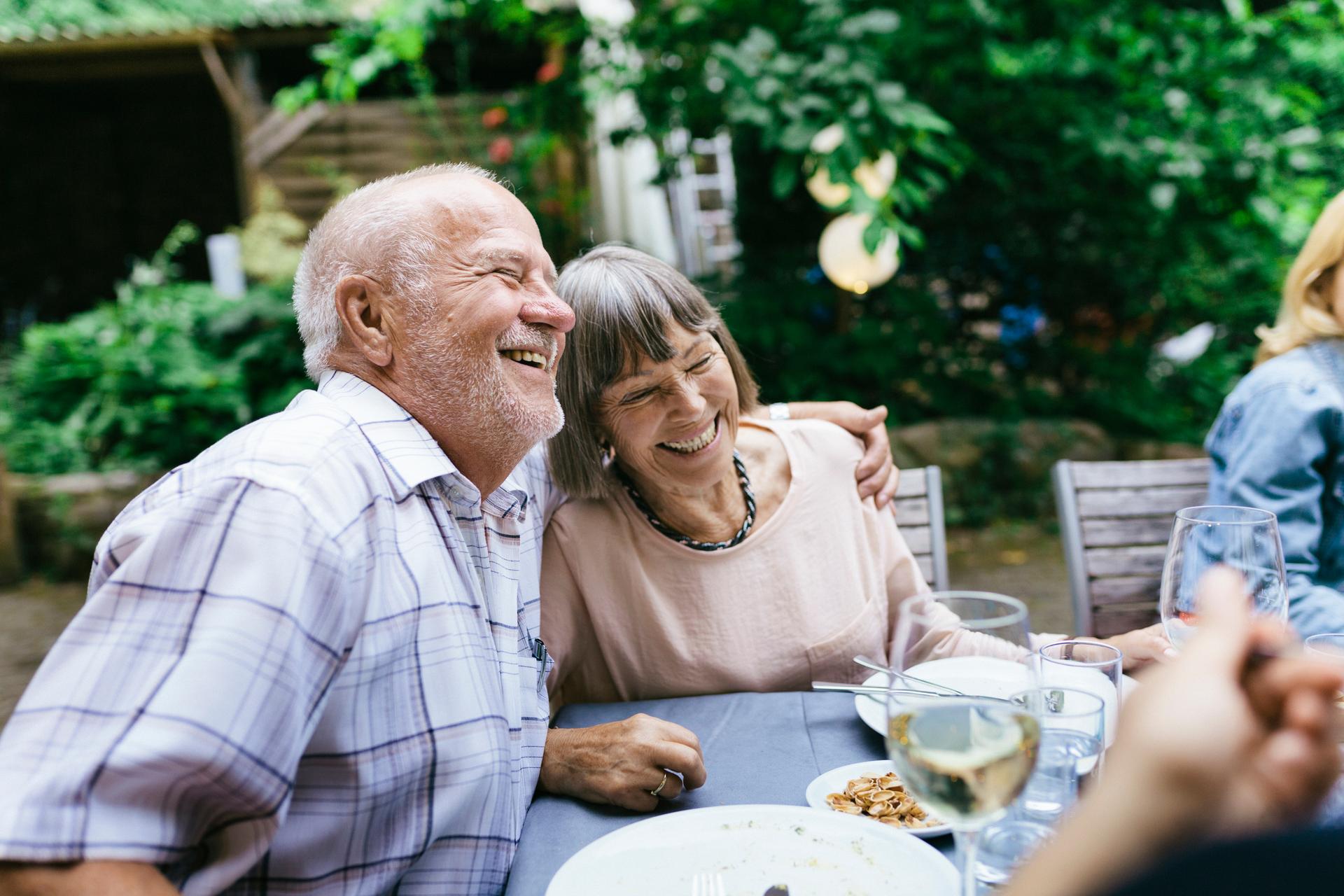 Photo of two people laughing