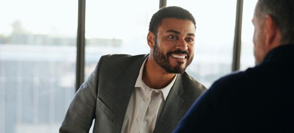 Man shaking hands with an advisor