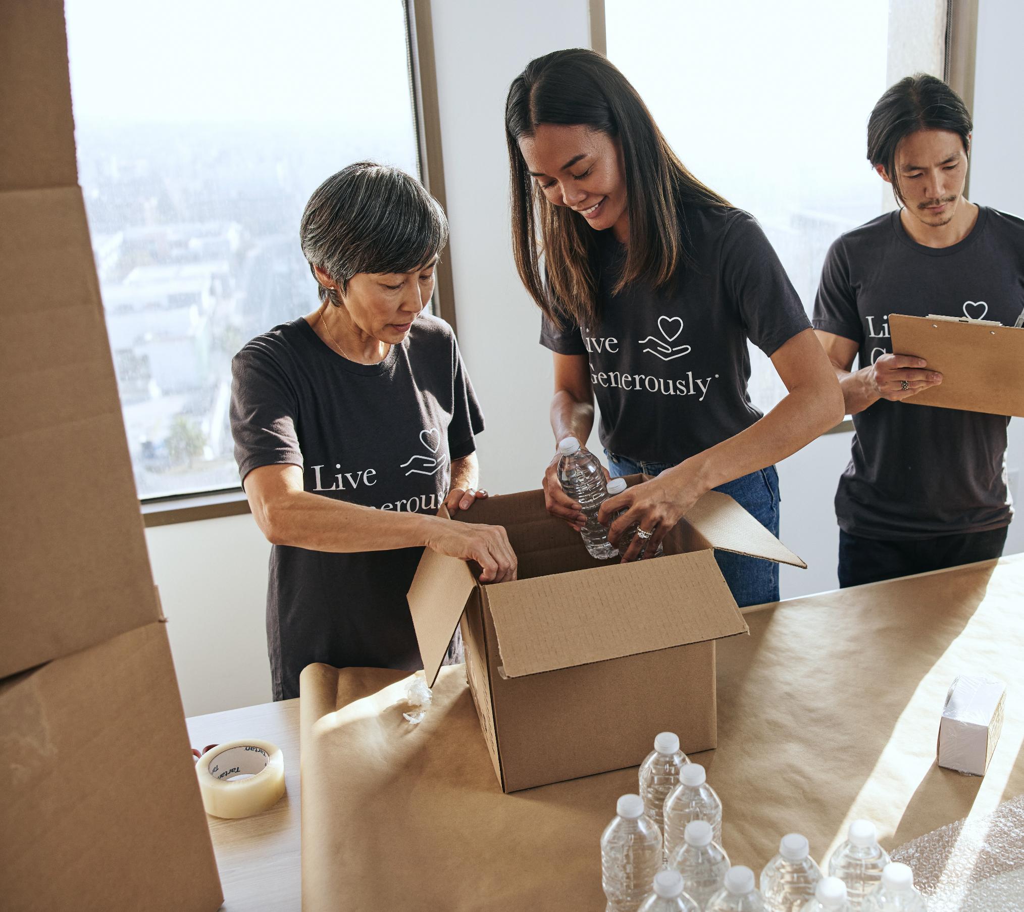 Thrivent Action Team Members filling a care package