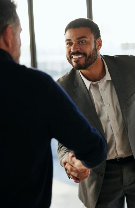 Man shaking hands with an advisor